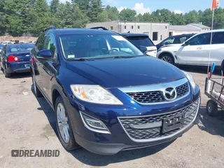 2011 Mazda CX-9 Grand Touring z VIN JM3TB3DV5B0304577, wystawiony jako IAAI lot #42833946 z przebiegiem 143 623 mil mil oraz . Historia ofert i sprzedaży dostępna na DreamBid. Obrazek 1.