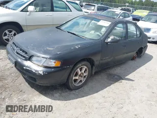 1999 Nissan Altima XE with VIN 1N4DL01DXXC193735, listed as a IAAI auction lot 41982408 with 153,008 mi miles. Bid and sale history available at carsss.com. Image 2.