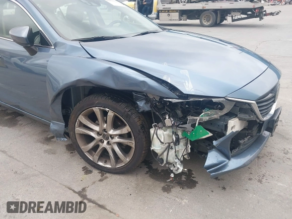 2014 Mazda 6 i Grand Touring with VIN JM1GJ1W64E1133729, listed as a IAAI auction lot 42050222 with 112,464 mi miles and . Bid and sale history available at DreamBid. Image 6.