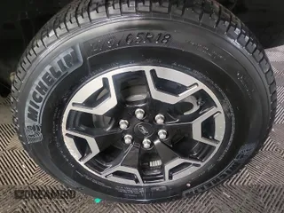 2023 Ford F-150 Lightning Pro z VIN 1FTVW1EL0PWG02840, wystawiony jako IAAI lot #42379448 z przebiegiem 52 710 mil mil oraz . Historia ofert i sprzedaży dostępna na DreamBid. Obrazek 44.