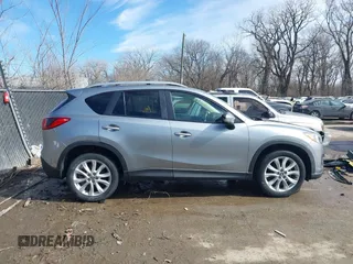 2014 Mazda CX-5 Grand Touring with VIN JM3KE2DY8E0375025, listed as a IAAI auction lot 41657755 with 103,601 mi miles. Bid and sale history available at carsss.com. Image 13.