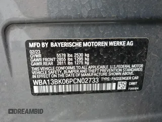 2023 BMW 5 Series M550i xDrive with VIN WBA13BK06PCN02733, listed as a Copart auction lot 48767235 with 27,725 mi miles and Salvage title. Bid and sale history available at DreamBid. Image 12.