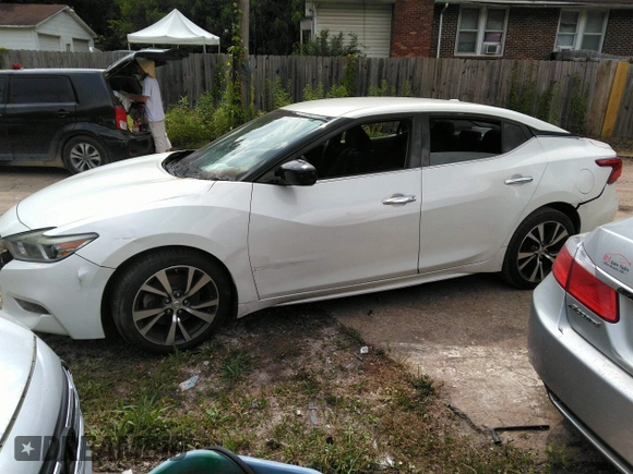 2017 Nissan Maxima SV z VIN 1N4AA6AP7HC424842, wystawiony jako IAAI lot #42452522 z przebiegiem 181 327 mil mil oraz . Historia ofert i sprzedaży dostępna na DreamBid. Obrazek 14.
