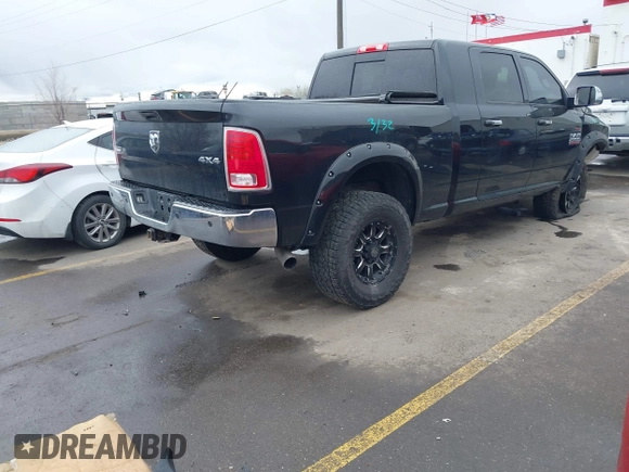 2015 Ram 2500 Laramie with VIN 3C6UR5NL2FG614941, listed as a IAAI auction lot 41785882 with 155,061 mi miles and . Bid and sale history available at DreamBid. Image 4.
