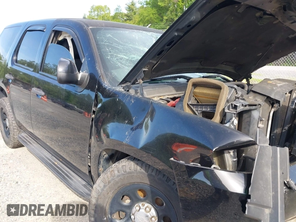 2013 Chevrolet Tahoe Commercial with VIN 1GNLC2E00DR265941, listed as a IAAI auction lot 42289977 with 206,840 mi miles and . Bid and sale history available at DreamBid. Image 16.