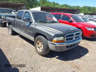 2001 Dodge Dakota Sport z VIN 1B7HL2ANX1S297770, wystawiony jako IAAI lot #42309715 z przebiegiem 279 458 mil mil oraz . Historia ofert i sprzedaży dostępna na DreamBid. Obrazek 1.