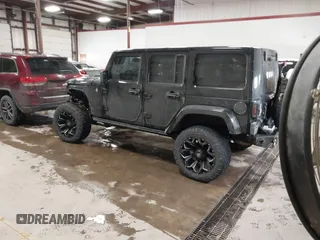 2015 Jeep Wrangler Unlimited Sahara with VIN 1C4BJWEG6FL688382, listed as a IAAI auction lot 41620621 with 138,119 mi miles. Bid and sale history available at carsss.com. Image 3.