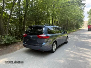 2015 Toyota Sienna LE AAS with VIN 5TDKK3DC1FS623710, listed as a Copart auction lot 62335575 with 221,148 mi miles and Clean title. Bid and sale history available at DreamBid. Image 4.
