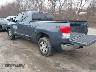 2010 Toyota Tundra with VIN 5TFUM5F16AX005232, listed as a IAAI auction lot 41688311 with 251,296 mi miles and . Bid and sale history available at DreamBid. Image 3.