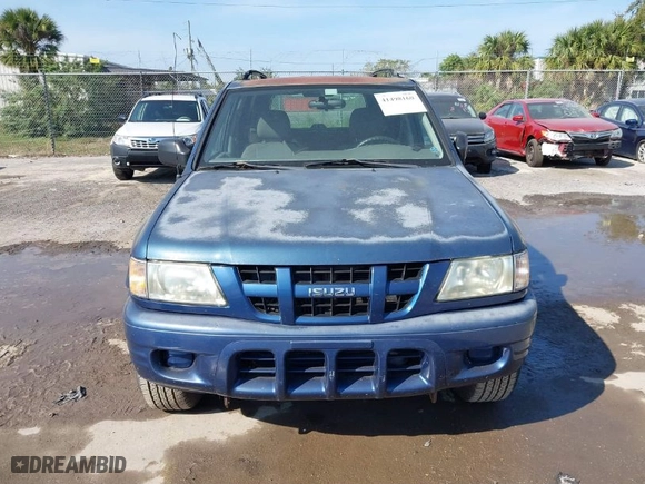 2004 Isuzu Rodeo S with VIN 4S2CK58W944317209, listed as a IAAI auction lot 41498160 with 114,764 mi miles. Bid and sale history available at carsss.com. Image 6.