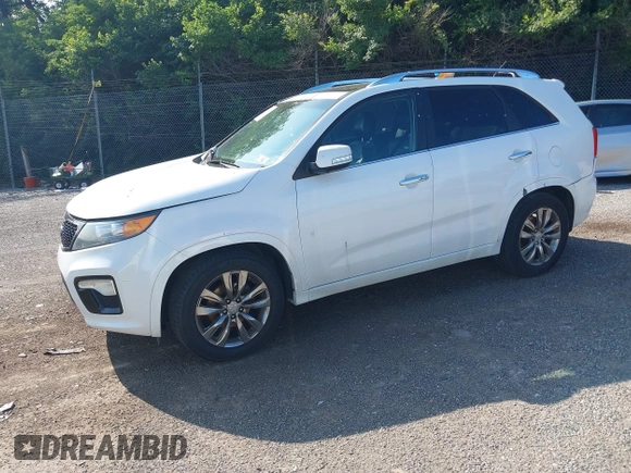 2012 Kia Sorento SX with VIN 5XYKWDA21CG253986, listed as a IAAI auction lot 42405849 with 218,540 mi miles and . Bid and sale history available at DreamBid. Image 2.