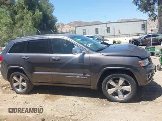 2015 Jeep Grand Cherokee Overland with VIN 1C4RJFCG7FC839778, listed as a IAAI auction lot 42490111 with 160,040 mi miles and . Bid and sale history available at DreamBid. Image 14.