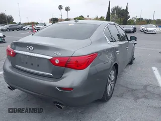 2015 Infiniti Q50 Premium with VIN JN1BV7AP6FM357265, listed as a IAAI auction lot 42104440 with 83,404 mi miles. Bid and sale history available at carsss.com. Image 4.
