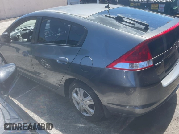 2011 Honda Insight LX z VIN JHMZE2H58BS005201, wystawiony jako Copart lot #57312335 z przebiegiem 195 020 mil mil oraz Czysty tytuł • Clean title. Historia ofert i sprzedaży dostępna na DreamBid. Obrazek 3.