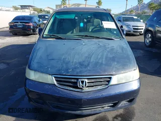 2004 Honda Odyssey EX z VIN 5FNRL18614B080980, wystawiony jako IAAI lot #41940014 z przebiegiem 233 465 mil mil oraz . Historia ofert i sprzedaży dostępna na DreamBid. Obrazek 12.