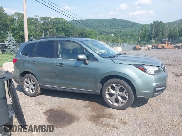 2017 Subaru Forester Touring with VIN JF2SJAWC8HH579492, listed as a IAAI auction lot 42571986 with 57,228 mi miles and . Bid and sale history available at DreamBid. Image 13.