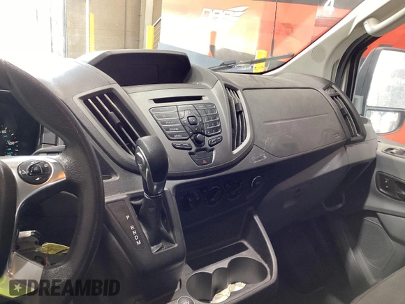 2018 Ford Transit with VIN 1FTBW2ZM8JKA77066, listed as a IAAI auction lot 42642396 with 215,234 mi miles and . Bid and sale history available at DreamBid. Image 17.