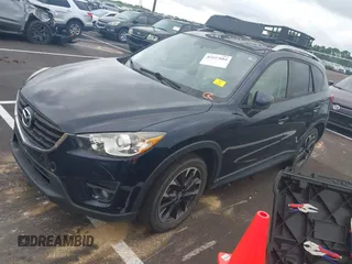 2016 Mazda CX-5 Grand Touring with VIN JM3KE2DYXG0890174, listed as a IAAI auction lot 42157884 with 141,873 mi miles. Bid and sale history available at carsss.com. Image 17.