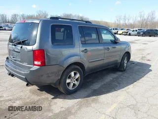 2011 Honda Pilot EX-L with VIN 5FNYF4H51BB065906, listed as a IAAI auction lot 41956370 with 233,977 mi miles and . Bid and sale history available at DreamBid. Image 4.