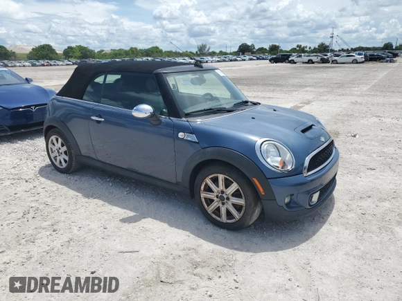2011 MINI Convertible S with VIN WMWZP3C50BTX83220, listed as a Copart auction lot 61590205 with 80,979 mi miles and Salvage title. Bid and sale history available at DreamBid. Image 4.
