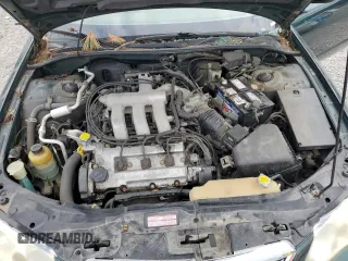 2001 Mazda Millenia z VIN JM1TA221011708952, wystawiony jako Copart lot #64995014 z przebiegiem Nie podano mil oraz Szkody całkowita. Historia ofert i sprzedaży dostępna na DreamBid. Obrazek 11.