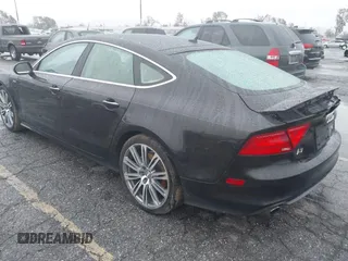 2014 Audi A7 3.0 Prestige with VIN WAU2GAFC5EN090233, listed as a IAAI auction lot 41565942 with 199,890 mi miles. Bid and sale history available at carsss.com. Image 3.