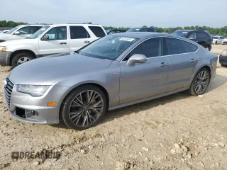 2016 Audi A7 Prestige with VIN WAU2GAFC9GN018146, listed as a Copart auction lot 60265005 with 115,330 mi miles and Salvage title. Bid and sale history available at DreamBid. Image 1.