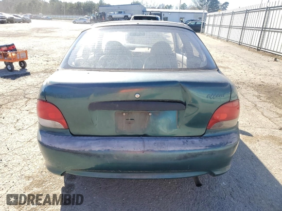 1999 Hyundai Accent z VIN KMHVD14N4XU456698, wystawiony jako Copart lot #41733345 z przebiegiem 197 574 mil mil oraz Szkody całkowita. Historia ofert i sprzedaży dostępna na DreamBid. Obrazek 6.