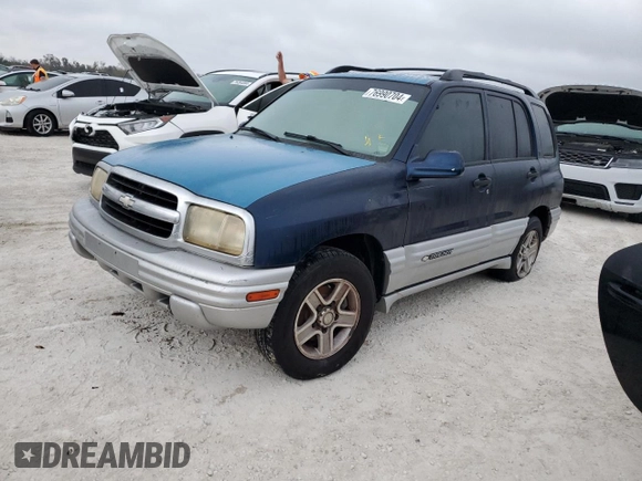 2002 Chevrolet Tracker LT with VIN 2CNBE634126928532, listed as a Copart auction lot 76990704 with Not provided miles and Salvage title. Bid and sale history available at DreamBid. Image 1.