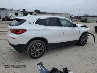 2023 BMW X2 sDrive28i with VIN WBXYH9C07P5V63719, listed as a Copart auction lot 87309194 with 43,124 mi miles and Salvage Title. Bid and sale history available at carsss.com. Image 3.