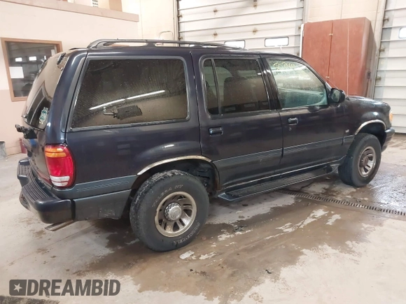 1999 Mercury Mountaineer z VIN 4M2DU55P0XUJ08169, wystawiony jako IAAI lot #42150344 z przebiegiem 164 994 mil mil oraz . Historia ofert i sprzedaży dostępna na DreamBid. Obrazek 4.