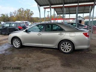 2014 Toyota Camry Hybrid LE with VIN 4T1BD1FK4EU106488, listed as a IAAI auction lot 40794286 with 98,911 mi miles. Bid and sale history available at carsss.com. Image 14.