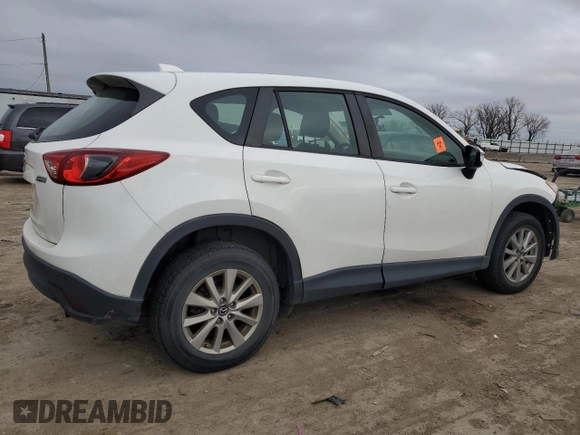 2015 Mazda CX-5 Sport z VIN JM3KE4BY2F0516574, wystawiony jako Copart lot #84100544 z przebiegiem Nie podano mil oraz Szkoda całkowita • Salvage title. Historia ofert i sprzedaży dostępna na DreamBid. Obrazek 3.