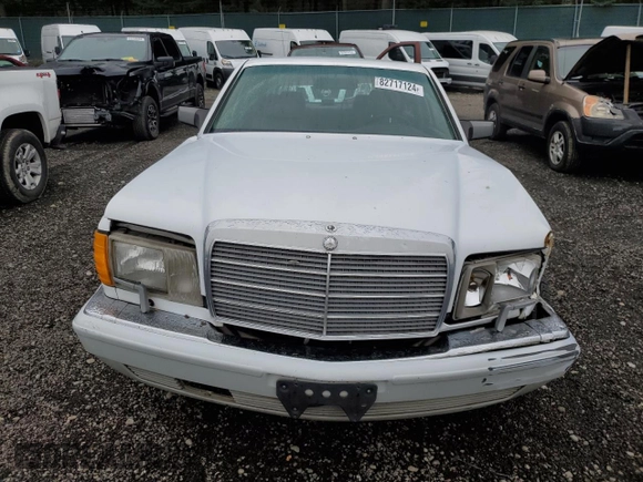 1990 Mercedes-Benz 300 with VIN WDBCA25D9LA550909, listed as a Copart auction lot 82717124 with 221,701 mi miles and Salvage Title. Bid and sale history available at DreamBid. Image 5.