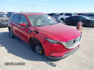 2016 Mazda CX-9 Touring with VIN JM3TCBCY7G0100311, listed as a IAAI auction lot 41588448 with 115,364 mi miles and . Bid and sale history available at DreamBid. Image 1.