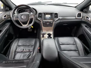2015 Jeep Grand Cherokee Overland with VIN 1C4RJECG4FC808241, listed as a Copart auction lot 59699685 with 67,542 mi miles and Salvage title. Bid and sale history available at DreamBid. Image 8.
