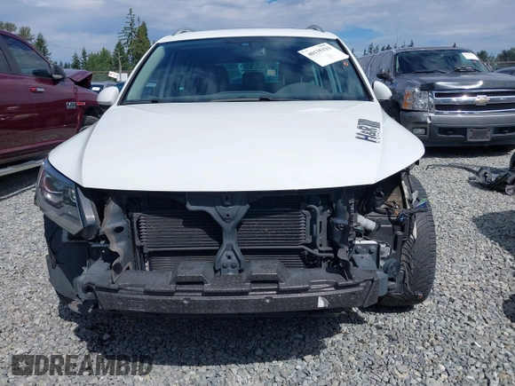 2016 Volkswagen Tiguan S with VIN WVGBV7AXXGW580052, listed as a IAAI auction lot 41444015 with 102,165 mi miles and . Bid and sale history available at DreamBid. Image 6.