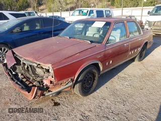 1990 Oldsmobile Cutlass Ciera with VIN 2G3AM54N7L2303078, listed as a IAAI auction lot 41882943 with 190,496 mi miles and . Bid and sale history available at DreamBid. Image 2.