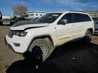 2021 Jeep Grand Cherokee Trailhawk with VIN 1C4RJFLG3MC646573, listed as a Copart auction lot 82687014 with 83,294 mi miles and Salvage Title. Bid and sale history available at carsss.com. Image 1.