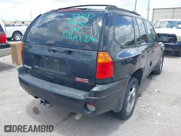 2005 GMC Envoy SLE with VIN 1GKDS13SX52373187, listed as a IAAI auction lot 42434190 with 112,965 mi miles and . Bid and sale history available at DreamBid. Image 4.