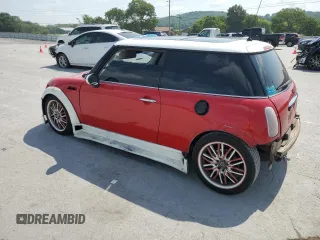 2004 MINI Hardtop with VIN WMWRC33444TC50103, listed as a Copart auction lot 63449615 with 144,467 mi miles and Salvage title. Bid and sale history available at DreamBid. Image 2.