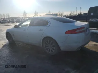 2015 Jaguar XF with VIN SAJXA0FS5FPU49437, listed as a Copart auction lot 84757254 with 99,301 mi miles and Salvage Title. Bid and sale history available at DreamBid. Image 2.