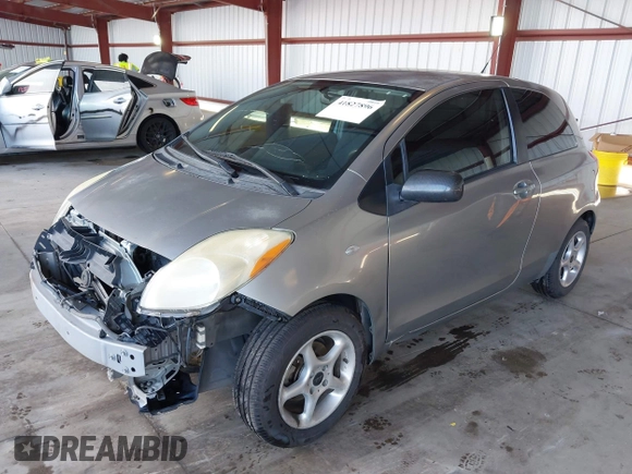 2009 Toyota Yaris with VIN JTDJT903095254673, listed as a IAAI auction lot 41830459 with 320,449 mi miles. Bid and sale history available at carsss.com. Image 2.
