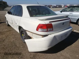 2001 Cadillac Catera z VIN W06VR54RX1R070430, wystawiony jako Copart lot #37051650 z przebiegiem 74 568 mil mil oraz Szkody całkowita. Historia ofert i sprzedaży dostępna na DreamBid. Obrazek 3.