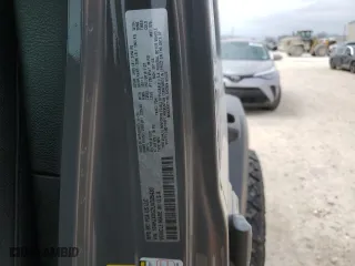 2020 Jeep Wrangler Unlimited Sport Altitude with VIN 1C4HJXDG2LW325430, listed as a Copart auction lot 46953185 with 69,919 mi miles and Salvage Title. Bid and sale history available at carsss.com. Image 14.