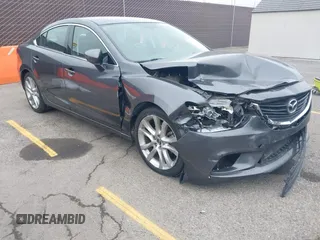 2016 Mazda 6 i Touring with VIN JM1GJ1V5XG1477626, listed as a IAAI auction lot 42133751 with 77,687 mi miles and . Bid and sale history available at DreamBid. Image 1.