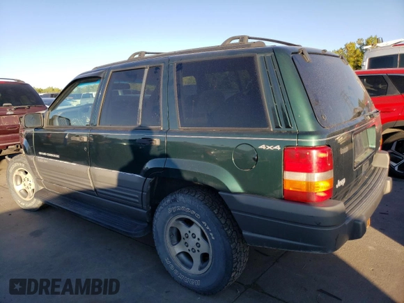 1997 Jeep Grand Cherokee Laredo with VIN 1J4GZ58Y6VC647434, listed as a Copart auction lot 73496824 with 124,946 mi miles and Salvage Title. Bid and sale history available at carsss.com. Image 2.
