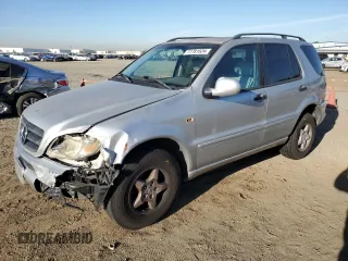 2000 Mercedes-Benz M-Class with VIN 4JGAB54E6YA181947, listed as a Copart auction lot 77781524 with 165,399 mi miles and Salvage Title. Bid and sale history available at carsss.com. Image 1.