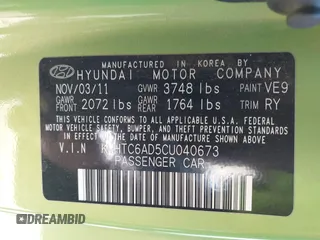 2012 Hyundai Veloster w/Gray Int z VIN KMHTC6AD5CU040673, wystawiony jako IAAI lot #41491429 z przebiegiem Nie podano mil oraz . Historia ofert i sprzedaży dostępna na DreamBid. Obrazek 9.