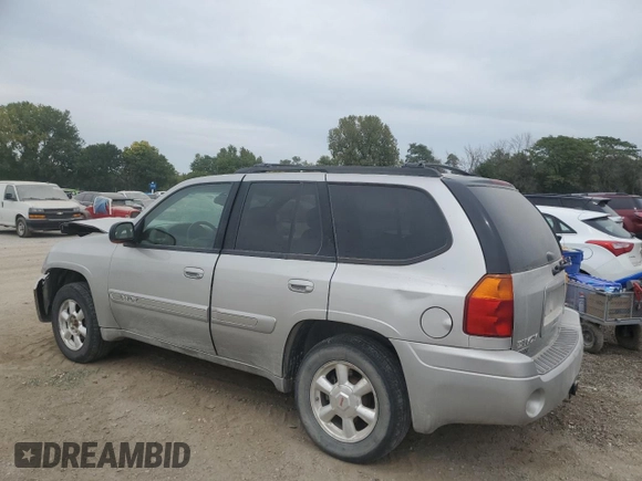 2005 GMC Envoy SLT with VIN 1GKDT13S852330514, listed as a Copart auction lot 71190504 with 203,616 mi miles and Salvage Title. Bid and sale history available at carsss.com. Image 2.